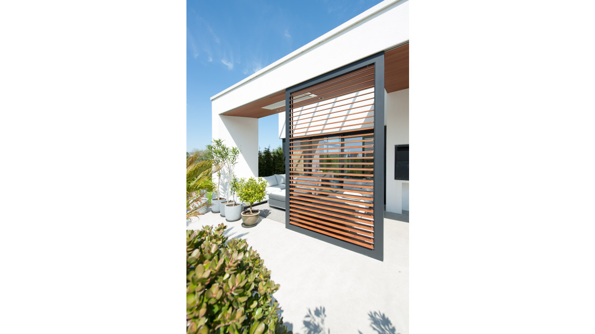 Aluminium Shutters with a woodgrain finish by Louvretec.