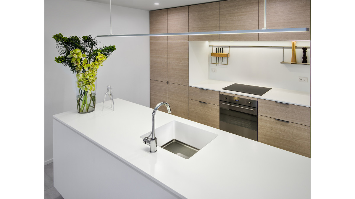 Corian Glacier White Benchtop and Duo Sink. <br />
Designed by Kathryn Watson (Advanced Joinery).<br />
Photography by Snap Photography.