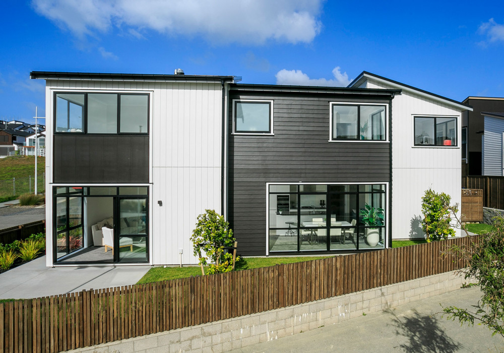 Black Downpipes and Spouting Match Joinery in Outstanding Coastal Home 