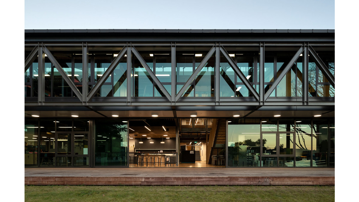 Tall APL Architectural sliding doors open on to the Kollective deck.