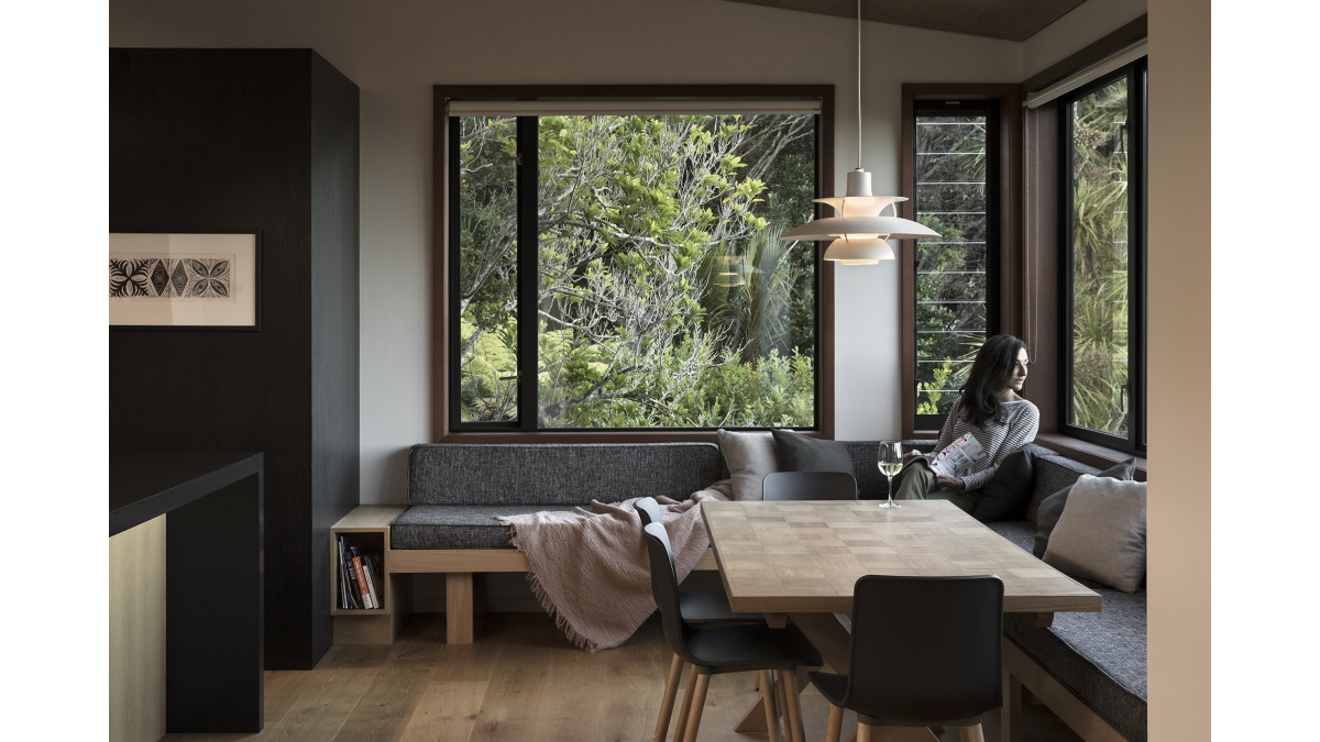 The sun-drenched breakfast nook features casement & louvre windows.