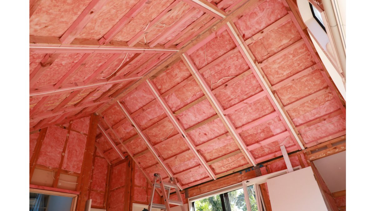 Installing insulation in skillion roof.