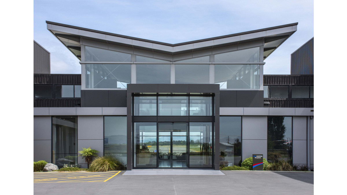 Main entrance with windows from the 40mm and Flushglaze systems in view.