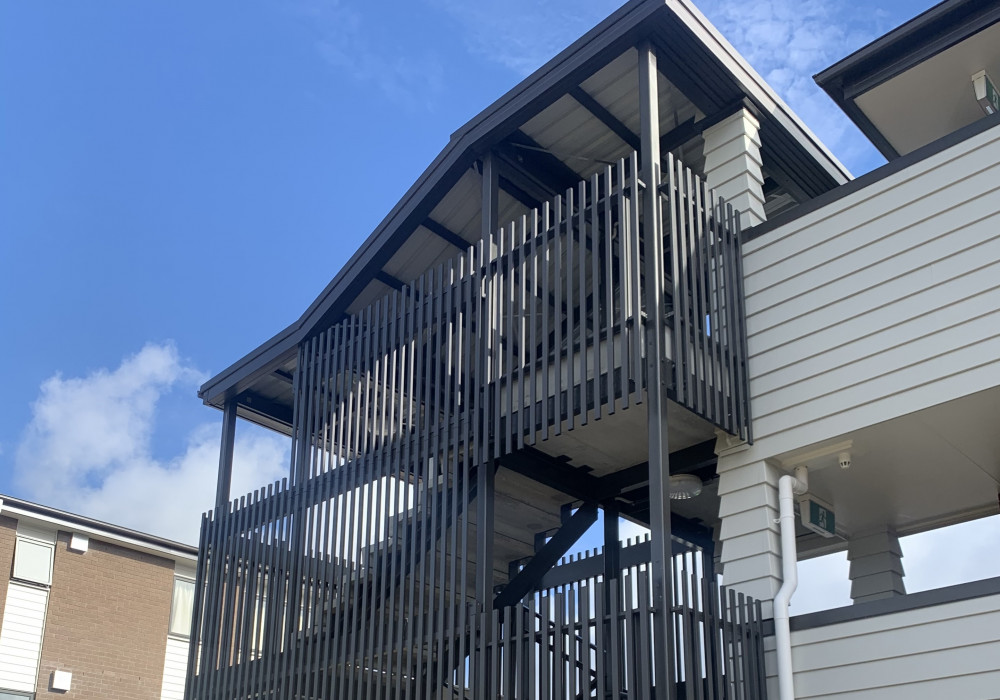 Stairwell Rain Screen Solution with Face Hung Fin System