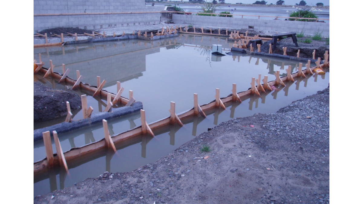 Flooded worksite with ponded water post Allco Voltex installation, pre slab pour.