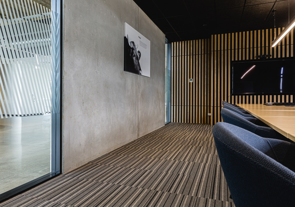 Sleek Office Fit-out Features Linear Patterned Carpets and Walls
