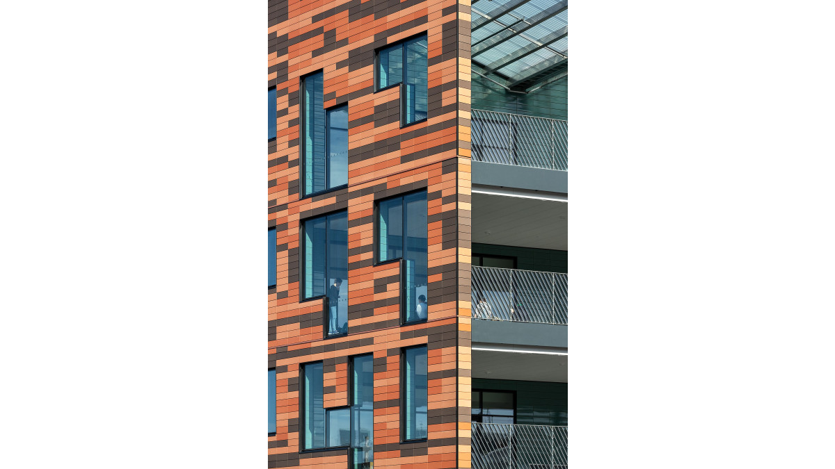 Rectangular Structural Glaze windows had solid infill panels that allowed terracotta tiles to be laid over the top for a stepped look.