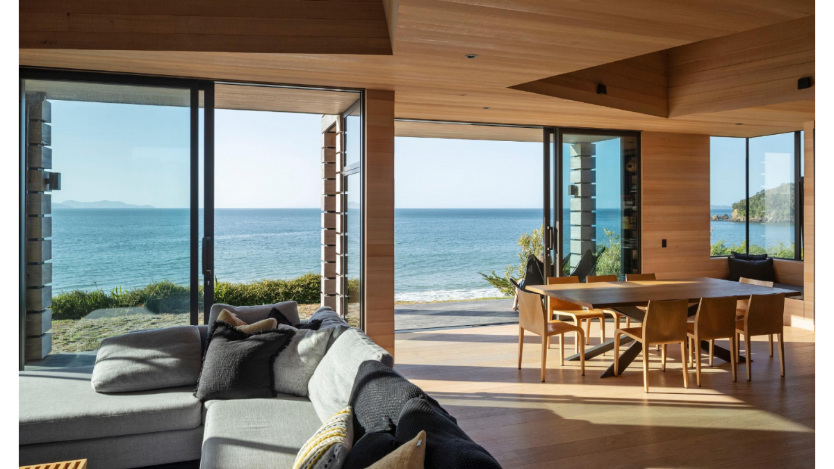 Metro Series sliding doors in Matt Ironsand frame the ocean view