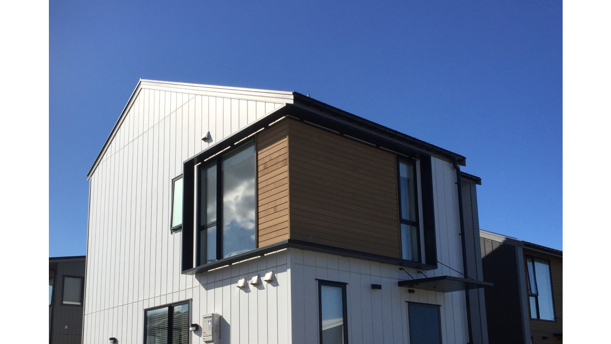 Corner window wrapped in Spectrum Facade Shrouds.