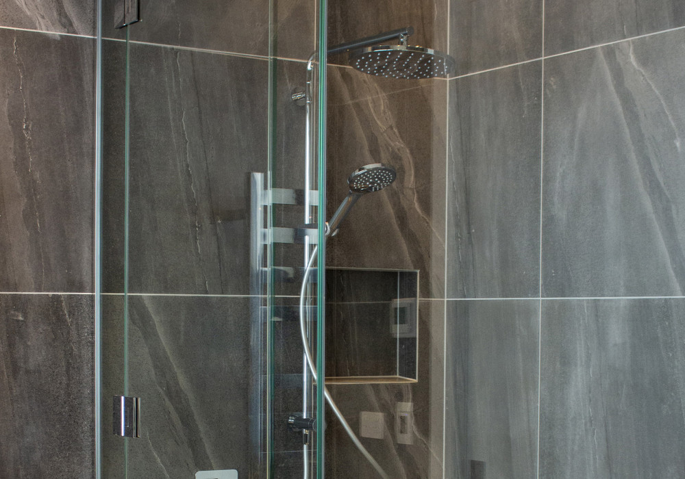 Designing with a Frameless Shower Door Can Help Make a Small Bathroom Bigger