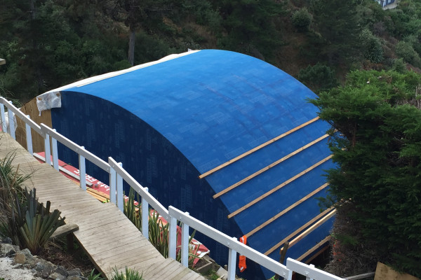 Unique Curved Roof Protected with High-Performance Building Wrap