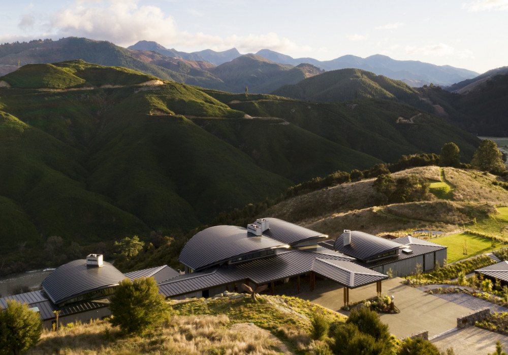 Dynamic Curved Metal Roofs Feature at Falcon Brae Villa