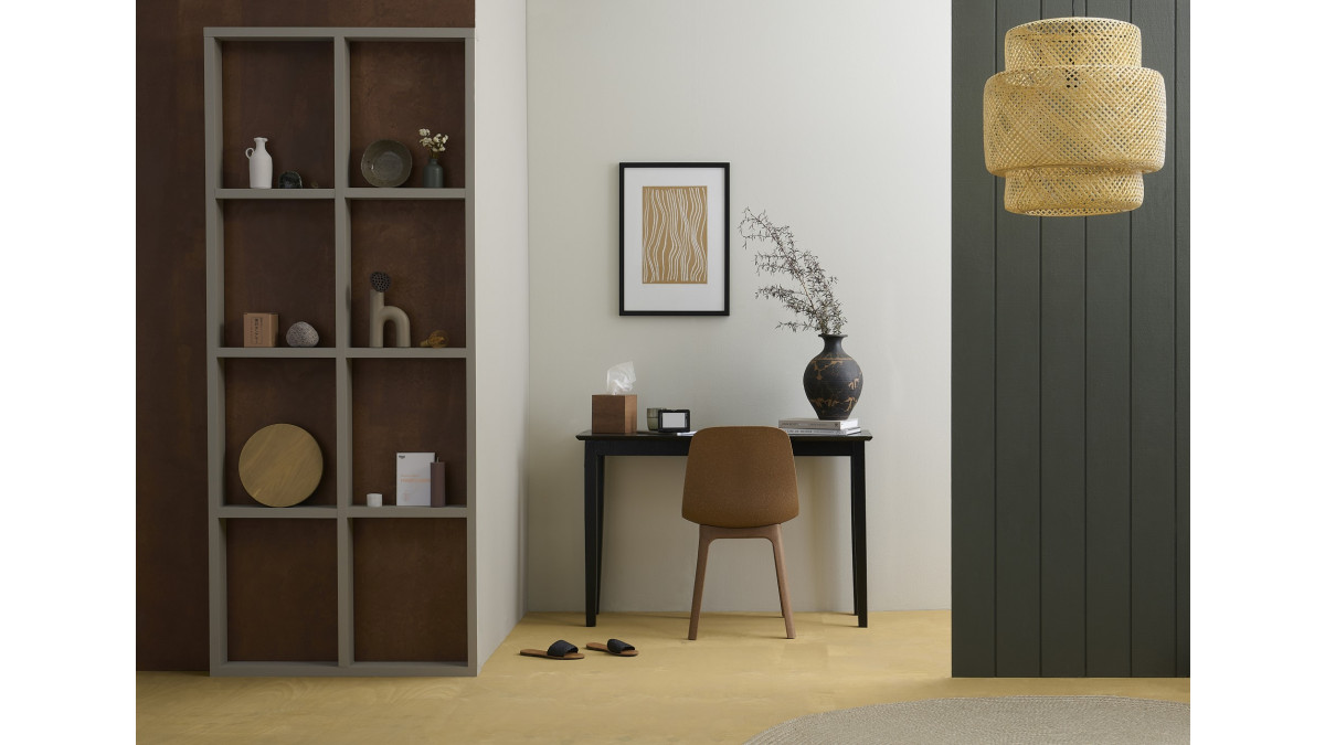 Back wall in Resene Triple Merino, timber wall (left) stained in Resene Colorwood Pickled Bean, grooved wall (right) in Resene Quarter Karaka, shelves in Resene Settlement, floor stained in Resene Colorwood Uluru and desk in Resene All Black.