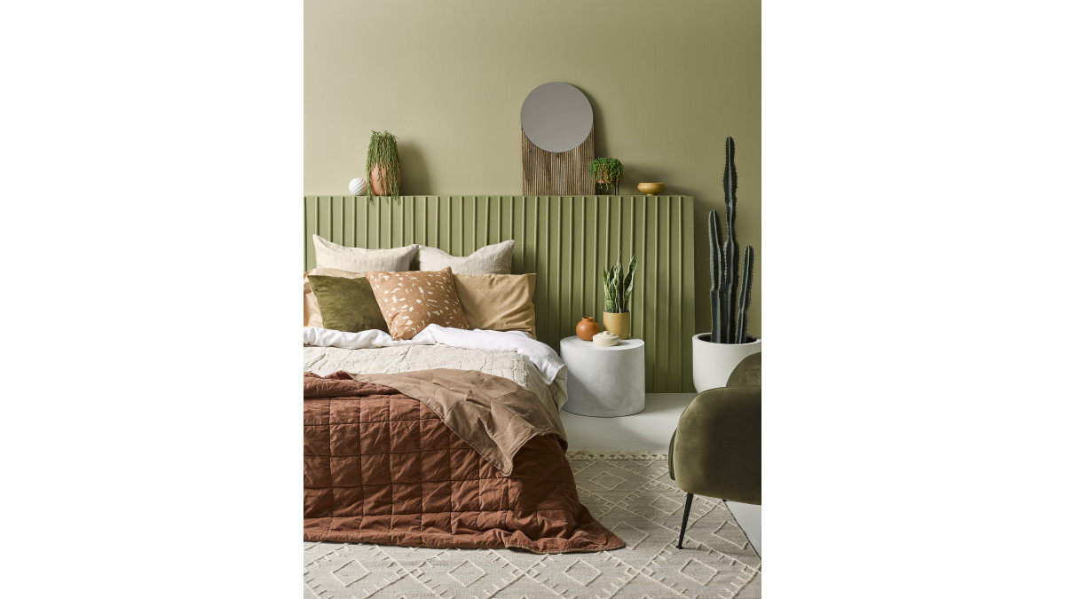 No colour is more popular in home decorating today than greens — especially olive tones. Upper wall in Resene Stone Age, lower wall and battens in Resene Wilderness, floor in Resene Green White.