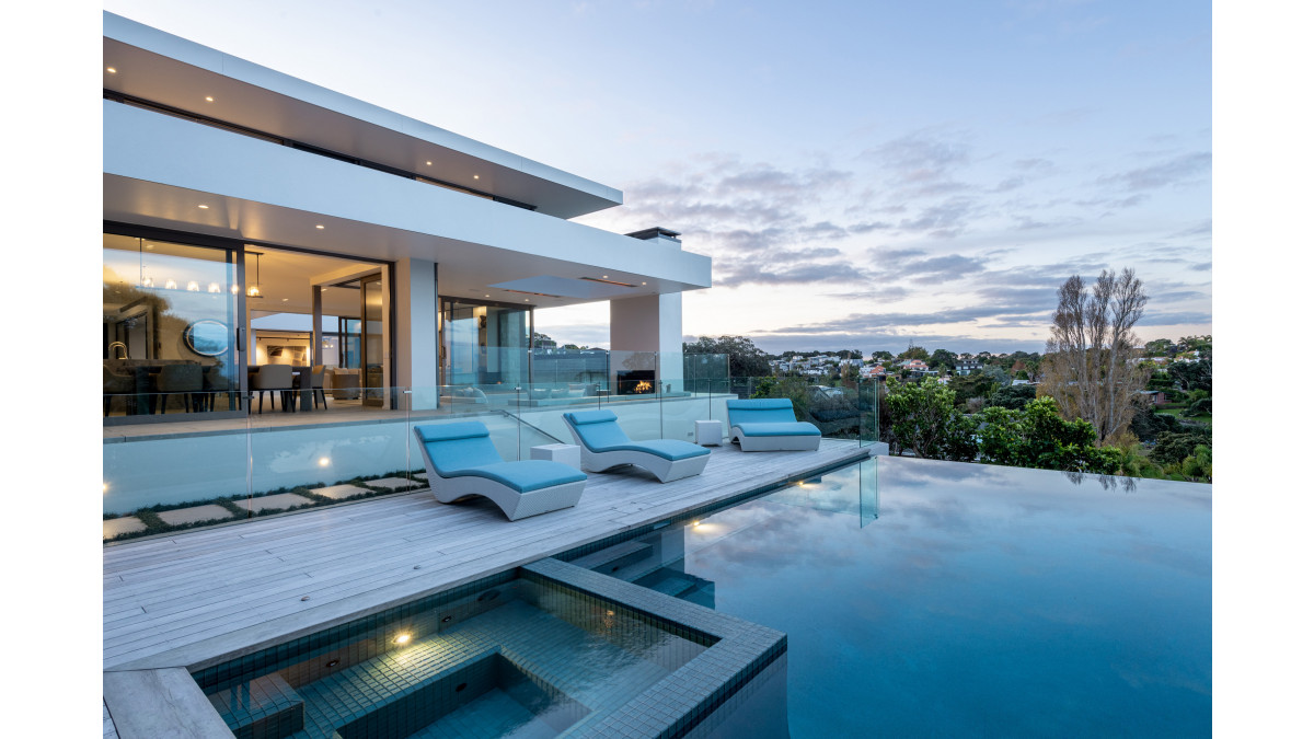 The house opens up to the outdoor living areas through a combination of both Vantage APL Architectural Series sliding doors and Metro Series doors in Metropolis Electric Cow Matt.