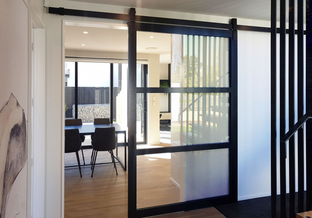 Barn Doors Create Feature Dividers in Kitchens