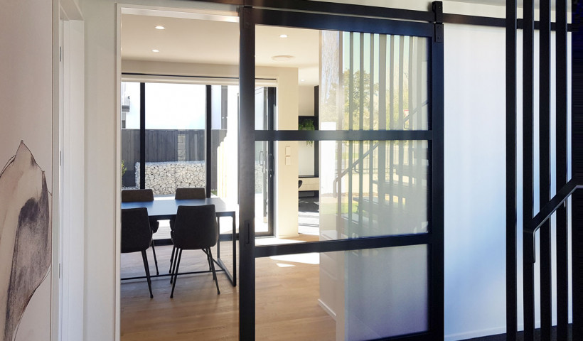Barn Doors Create Feature Dividers in Kitchens