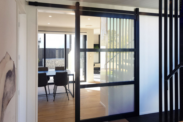 Barn Doors Create Feature Dividers in Kitchens