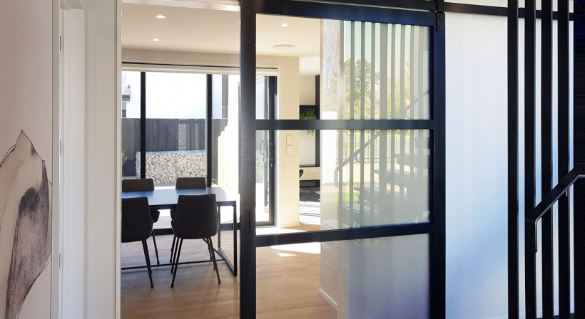 Barn Doors Create Feature Dividers in Kitchens