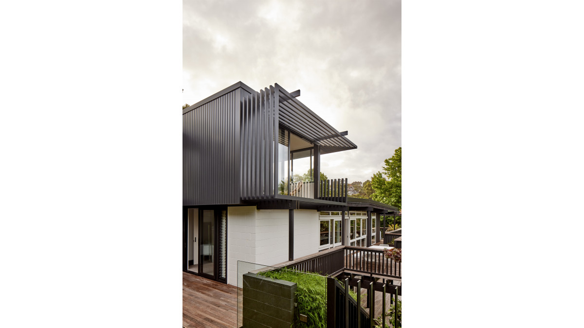 This renovation project broke through the flat-roofed rectangle of the existing dwelling, using Metro Series joinery in Matt Flax Pod.