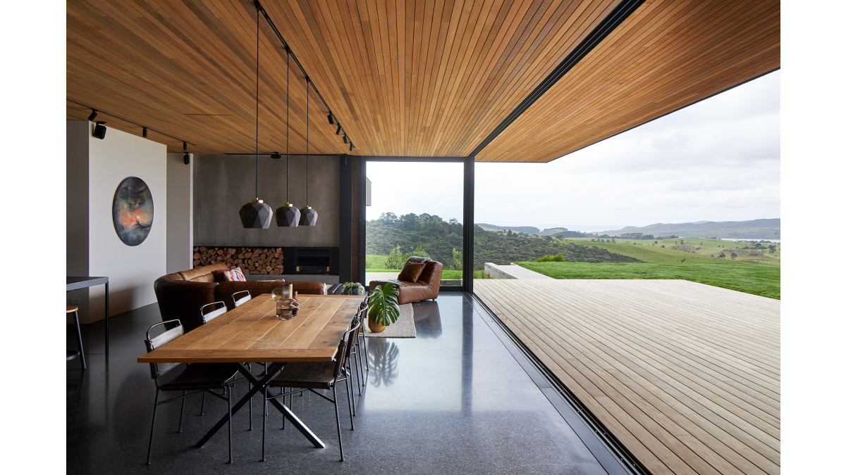This floor-to-ceiling stacking APL Architectural Series sliding door slides away into a cavity, creating a completely open wall.