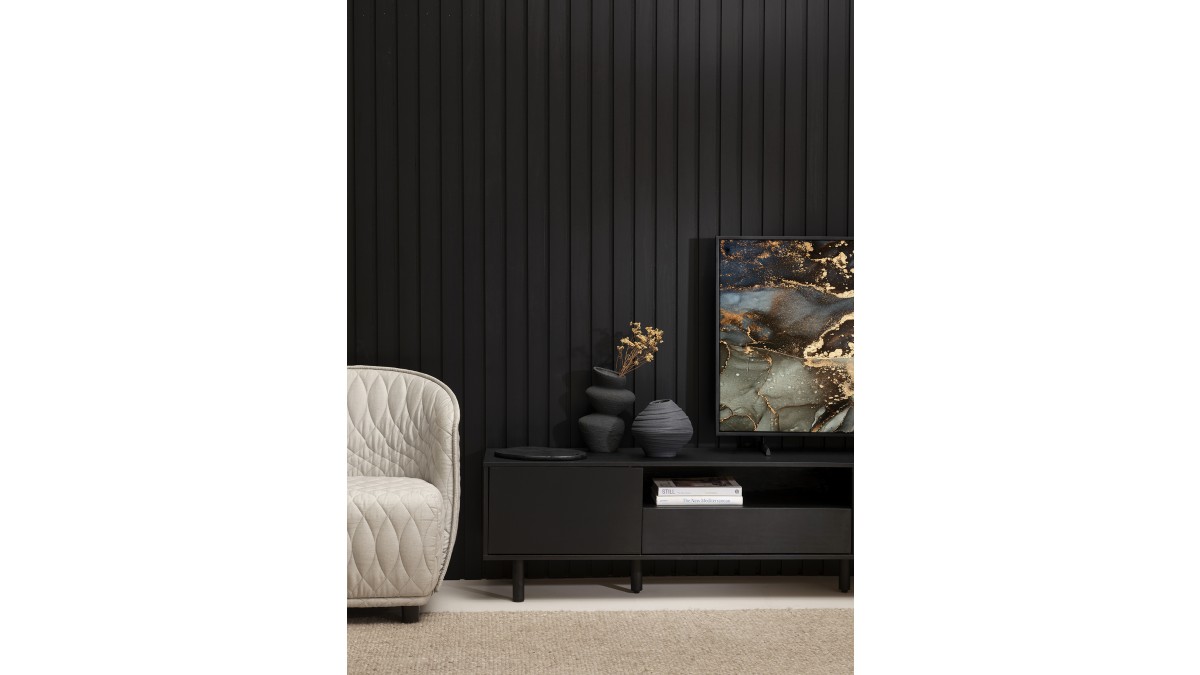 Slat wall Resene Blackest Black. Floor in Resene Stepping Stone. Cabinet in Resene Nero. Large vase on cabinet in Resene Element, small vase in Resene Foundry, candle-stick holder in Resene Nero, board in Resene Blackest Black. Chair from Matisse.