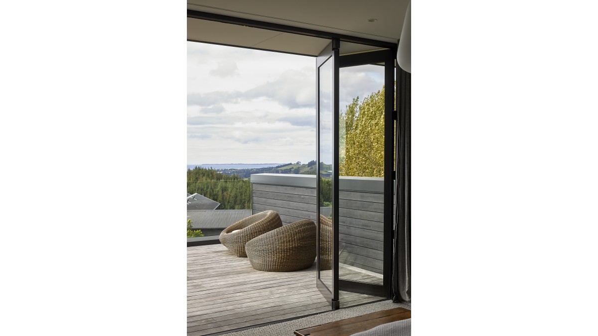 Bi-fold doors open up to the ocean view.