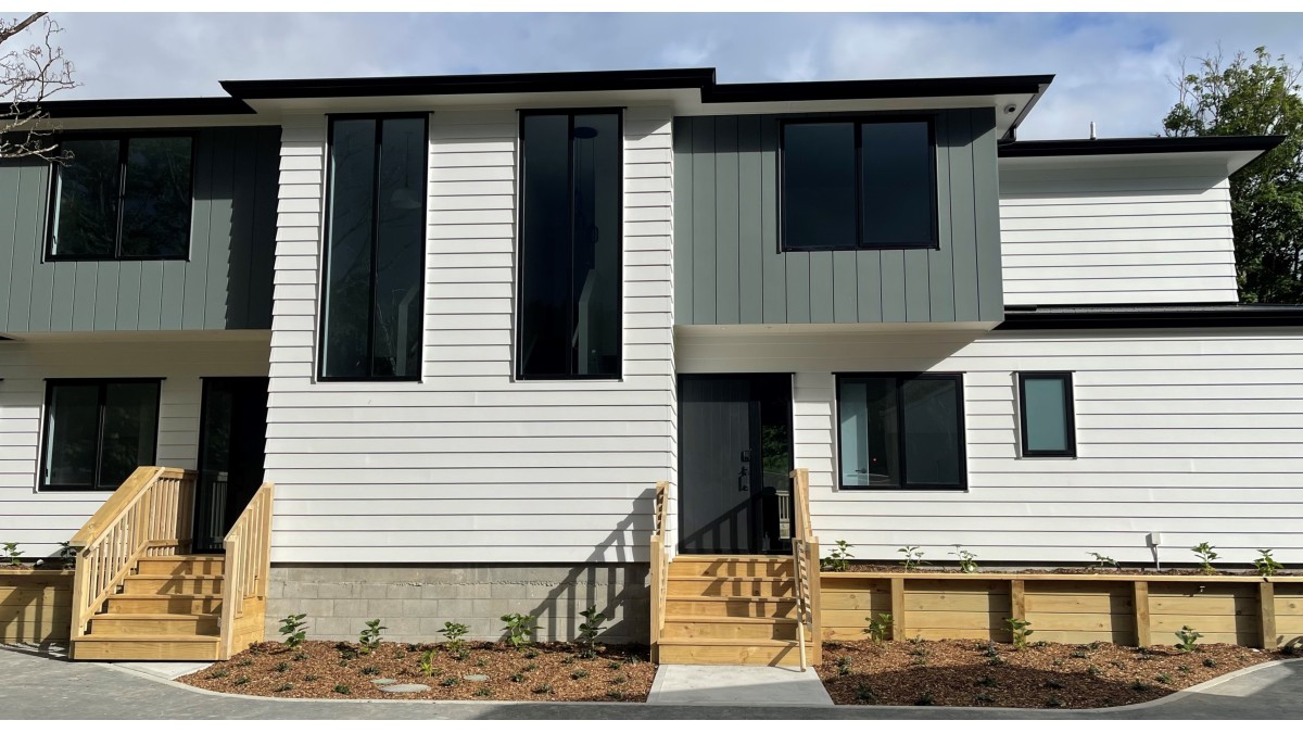The first stage in this townhouse development uses hot water heat pump technology for potable hot water and central heating.