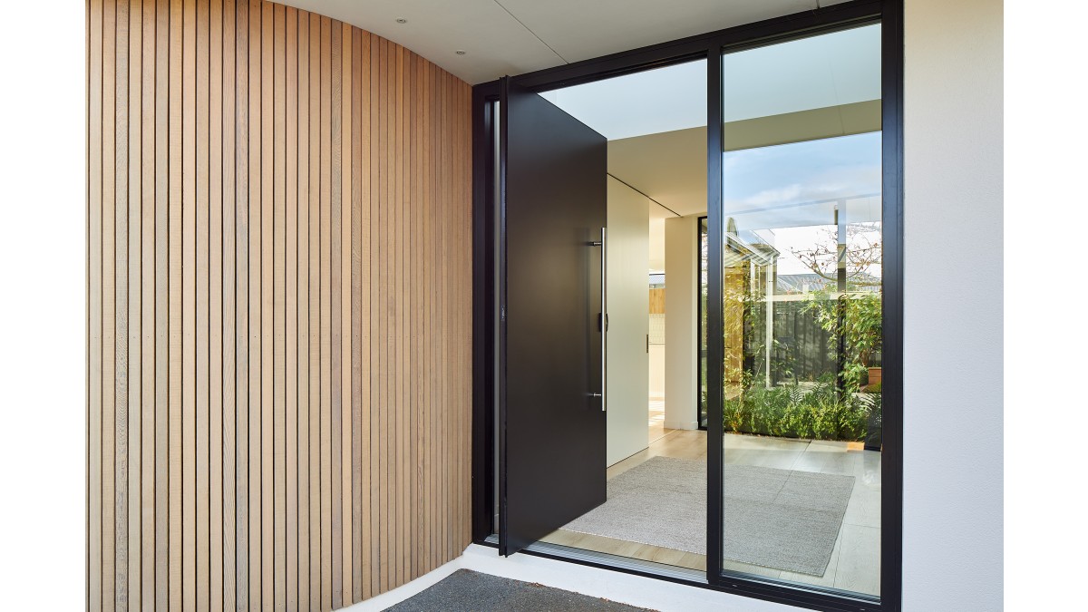 A warm welcome through the Plasma Entrance Door in Matt Black.