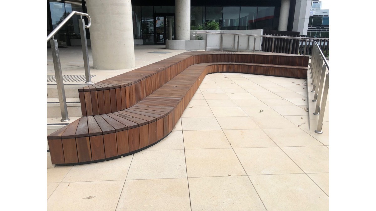 Curved bench seats and sandstone pavers on QwickBuild.