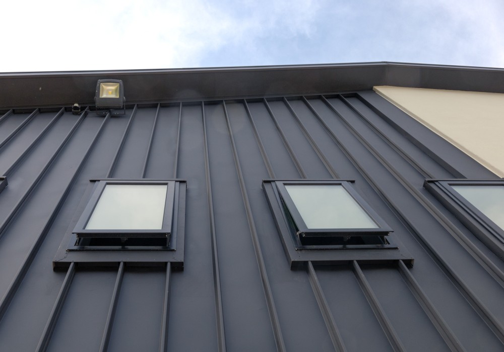A Modern Cladding Profile for Historic Sports Club Refurbishment