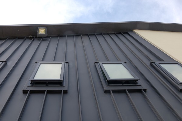 A Modern Cladding Profile for Historic Sports Club Refurbishment