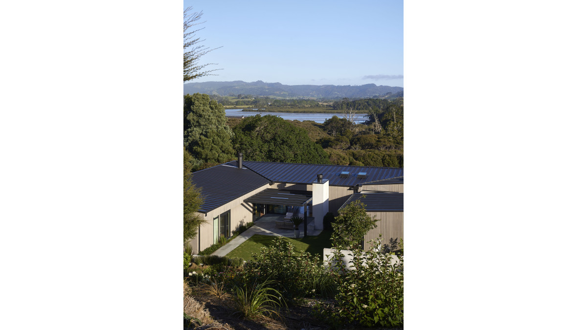 The build overlooks the Matakana harbour.