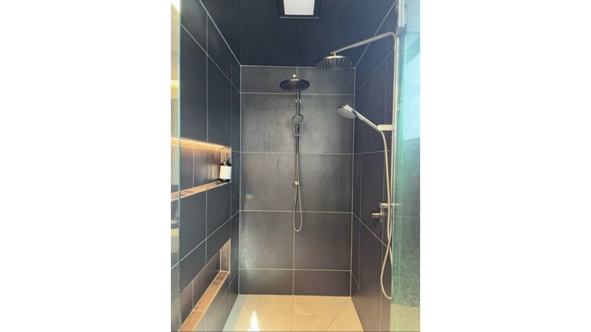 Framed shower enclosure lined with GIB Aqualine Shower walls with tiled finish.