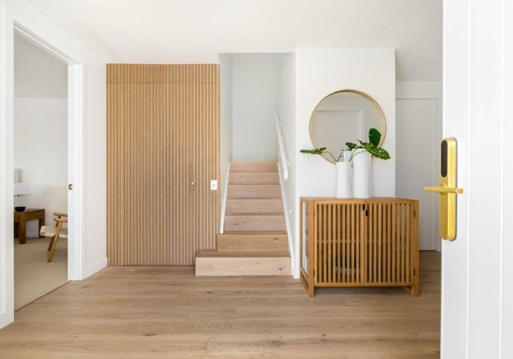 Clever Use of Vertical Wooden Slats Turns Affordable Powerglide Elevator into a Design Feature