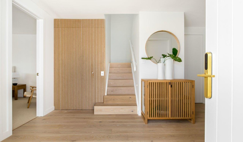 Clever Use of Vertical Wooden Slats Turns Affordable Powerglide Elevator into a Design Feature