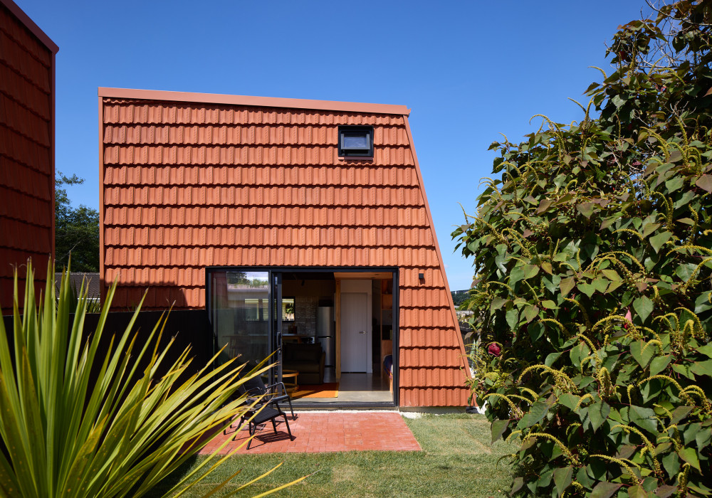 Terracotta Roof Tiles Repurposed as Striking Wall Cladding for Pocket House