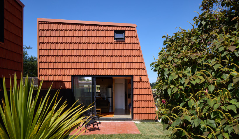 Terracotta Roof Tiles Repurposed as Striking Wall Cladding for Pocket House