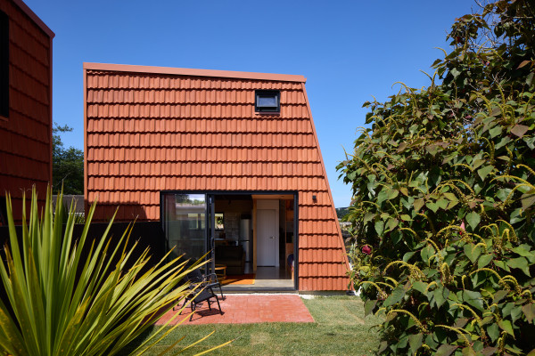 Terracotta Roof Tiles Repurposed as Striking Wall Cladding for Pocket House