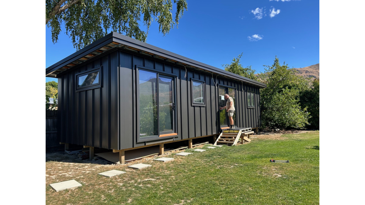 An example of a Tiny House in Wanaka. Structure uses cold formed steel systems from Rollforming Services and Speedfloor, including floor joists, X-TENDA telescopic framing and roof panels.