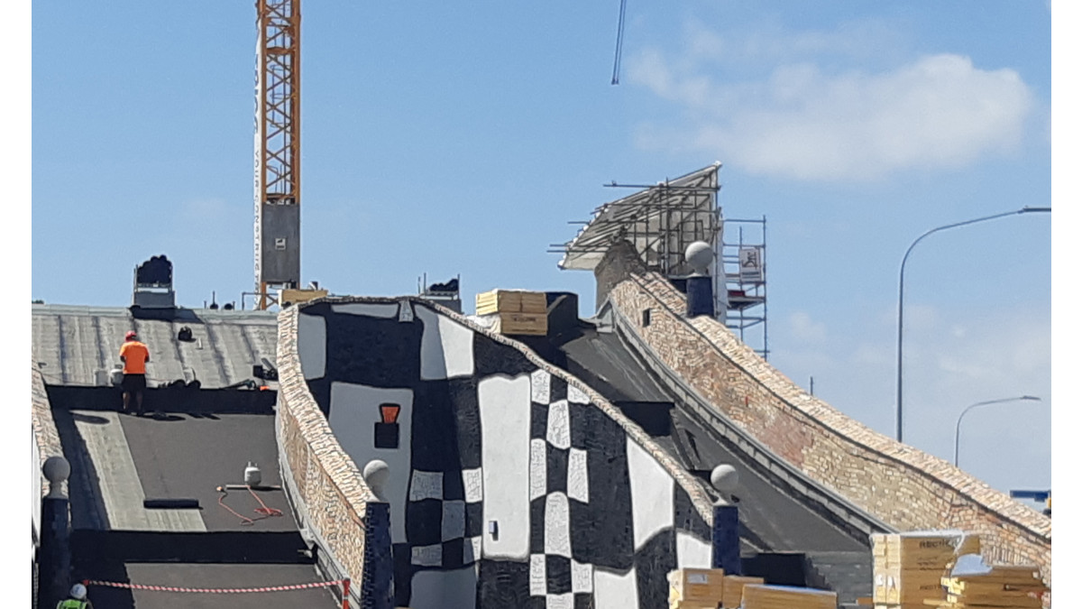 Installation of waterproofing membrane on ramps.