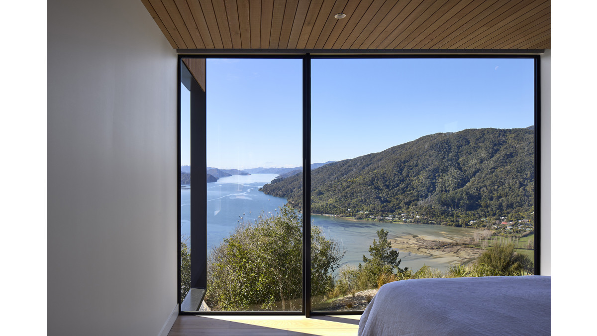 APL Architectural Series custom window frames the bedroom view.