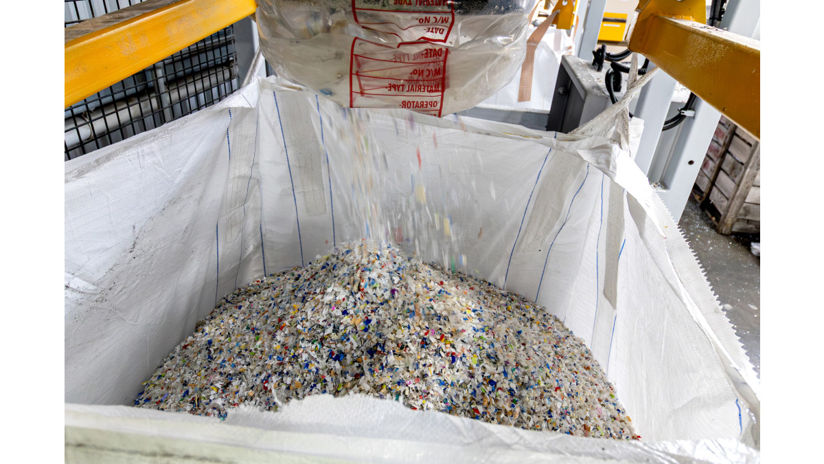Cleaned and fragmented plastic ready to be converted into plastic pellets.