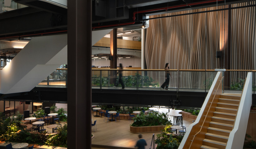 Bespoke Acoustic Feature Wall Reduces Reverberation in a Shared Office Atrium