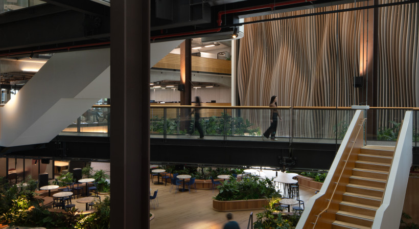 Bespoke Acoustic Feature Wall Reduces Reverberation in a Shared Office Atrium