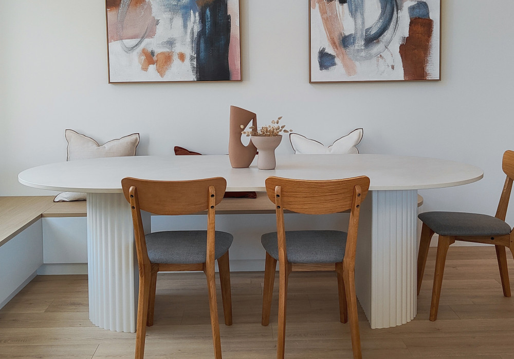 A Dining Table Brings Warmth and Practicality with Dekton Albarium
