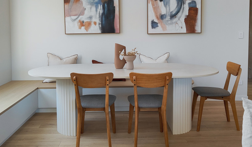 A Dining Table Brings Warmth and Practicality with Dekton Albarium
