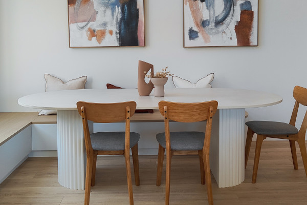 A Dining Table Brings Warmth and Practicality with Dekton Albarium