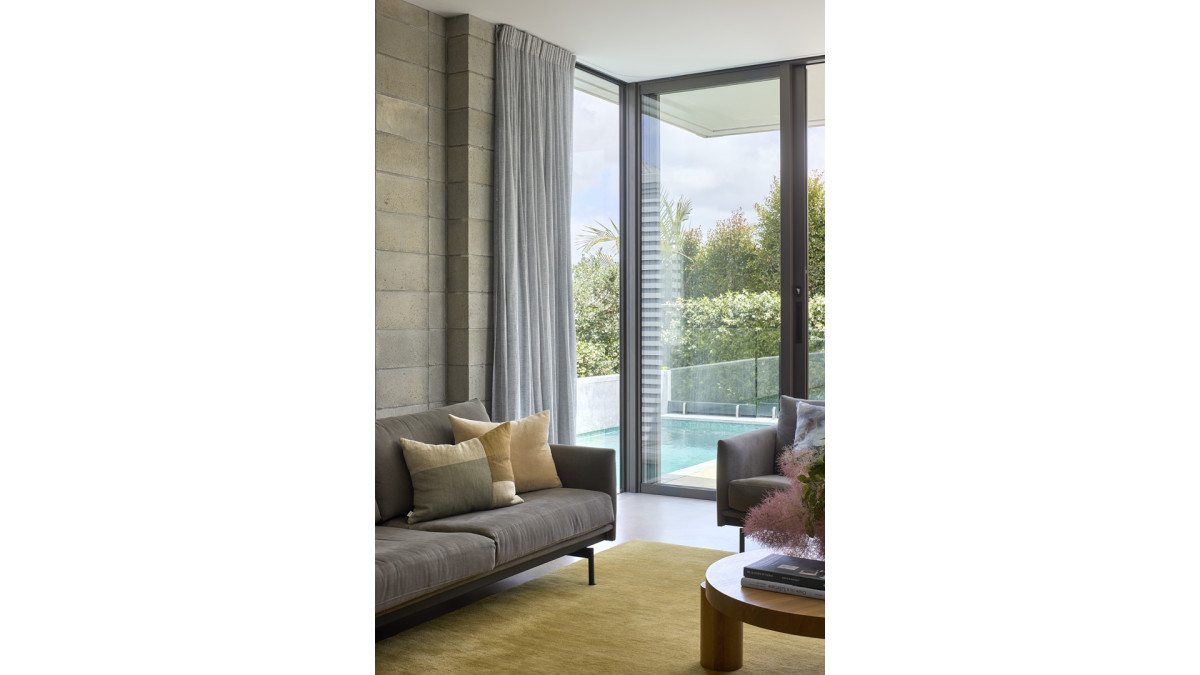 Floor to ceilling windows and doors allow the light to stream in.