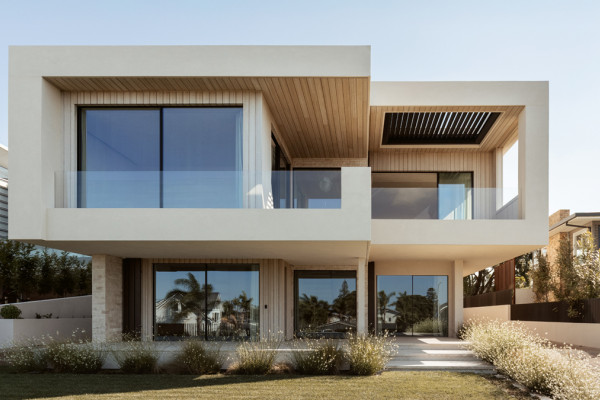 A Seamless Plaster Finish Inside and Out for Oceanview Road House
